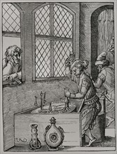 Making of coins. Facsimile of an engraving by Jost Amman in 1659. Sciences & Lettres au Moyen Age