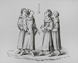 Medieval monks playing the game of bob apple or swinging apple. The apple was hung on a rope and