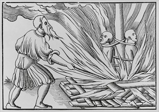 Torture by fire. Engraving after a woodcut in Sebastian Munster's ""Cosmographia universalis"",