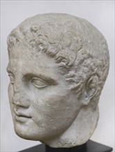 Head of Hermes. Probably a bigger part of a slab with face in high relief. 2nd century AD. From