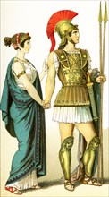 The figures represent two ancient Greeks: a woman of the upper class and her husband, a commander