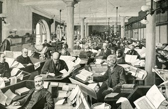 This image dates 1900 and the caption reads: Editorial Room of the Standard Dictionary - some of