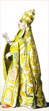 The figure pictured here represents Pope Alexander VI in 1500 A.D. He is dressed in the vestments