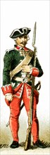 The figure represented here is a French guardsman under Louis XV from 1700 to 1750 A.D. The