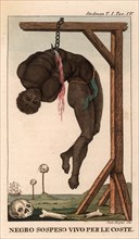 A black slave hangs by his upper body from a hook attached to a gallows.