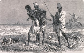 A prisoner being led to his execution through a field littered with skulls and skeletons.