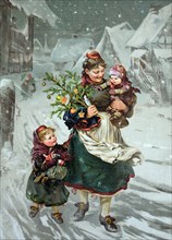 Woman with two children and a small decorated Christmas tree and presents walks through the village in the snow.