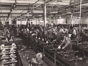 Wolseley factory interior with workers at machinery, Wolseley Motor Company was a British car