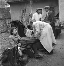 Refugees after crossing border to Switzerland; 1944.