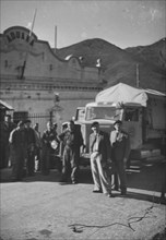 Swiss truck, driver at the customs; 1944.