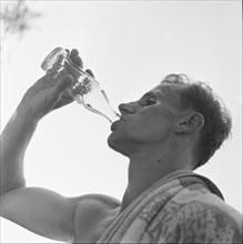 Rome 1960: footballer drinking Coca Cola, bottle.