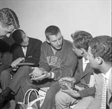 Rome 1960: discus thrower Al Oerter with journalists.