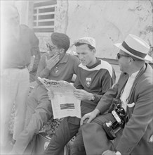 Olympic Games Rome 1960: Bruno Galliker reading newspaper Sport.