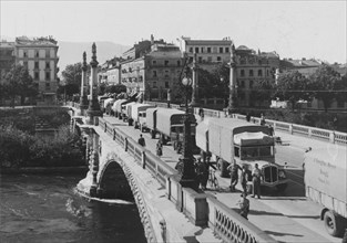 Swiss trucks travelling in convoy leaving Geneva; 1941.