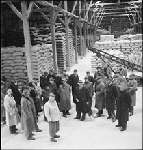 Journalists visiting supply inventory, cereals; grain, stock; 1944.