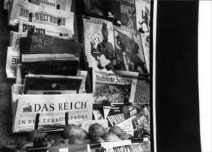 Newspapers at Newsstand, 1944 .