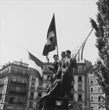 Young men celebrating the end of second world war; 1945 .