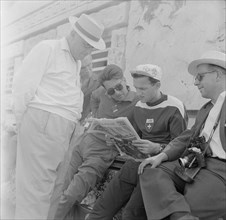 Olympic Games Rome 1960: Bruno Galliker reading newspaper Sport.