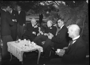 Winston Churchill with Swiss public figures at afternoon coffee 1946 .