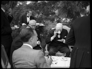 Winston Churchill with Swiss public figures at afternoon coffee 1946 .