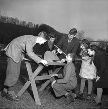 A. Reber, astronomer with students, 1947.