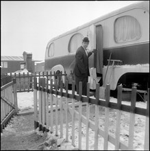 Jacques Romeo Andreff in front of his caravan, trailer.