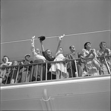 People waving to somebody on lookout terrace at airport Zurich-Kloten around 1956.