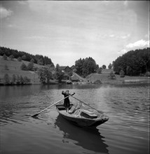 Girl standing in a rowing boat on Lake Rotsee 1947