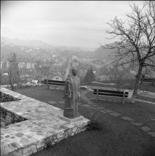 Statue of a monk Le Defricheur at Boudry Castle, 1960.