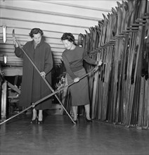 Skier Olivia Ausoni manages her sporting goods store in Lausanne ca. 1955.