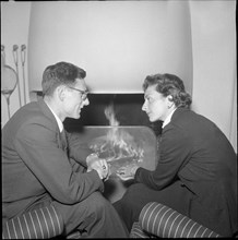 Marc Wirz and Jeannette Altwegg in love in front of fireplace, Berne 1954.