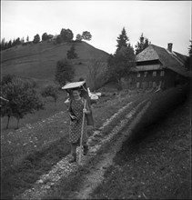 Young woman bringing her textiles to the railway station 1964 .