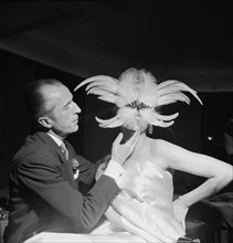 Beautician Fernand Aubry with model, ca. 1955 .