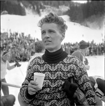 Josl Riederer, Austrian skier, with cup of Ovomaltine, 1958.