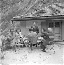 Engineer explaining details on the construction of a bridge in the Schöllenen ravine,  1955.