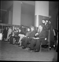 People waiting at postal cheque services Zurich, around 1960.