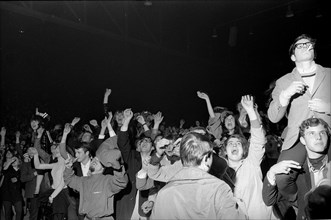 Cheering fans at Rolling Stones concert at Hallenstadion, Zurich 1967 .