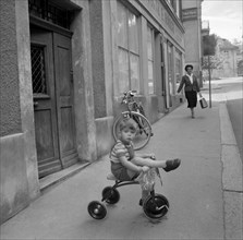 Boy on a  tricycle , Zurich around 1960.