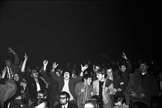 Cheering fans at Rolling Stones concert at Hallenstadion, Zurich 1967 .