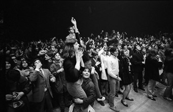 Cheering fans at Rolling Stones concert at Hallenstadion, Zurich 1967 .