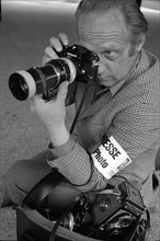 Press photographer with press armlet, 1970