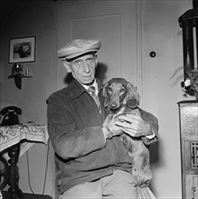 Emil Senn with his dog, 1956