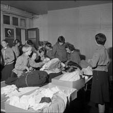 Basel girl scouts sorting clothing for Hungary 1956