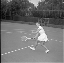 Jeannette Altwegg playing tennis, ca. 1955