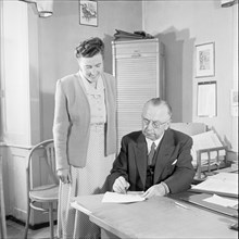 Federal Councillor Josef Escher and his secretary at home in Brigue 1950