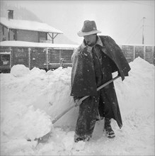 Man clearing the snow away, Davos 1951