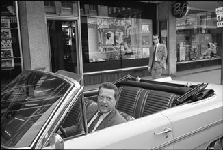 Hairdresser Albert Ryf in his car in front of his barbershop, Zurich 1966