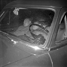 Pressmen waiting in a car, Romanian embassy Berne occupied by four armed Romanians, 1955