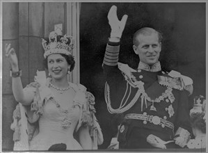 Waving to the crowd from the Buckingham Palace balcony