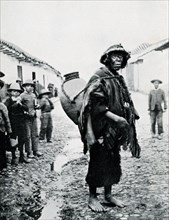 This photograph, dating to 1914 or earlier, shows an Indian water carrier in Sicuani, a town in